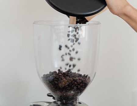 Coffee beans being added to the mixer