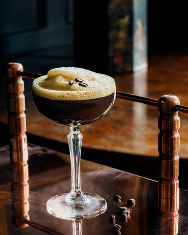 A glass filled with coffee martini