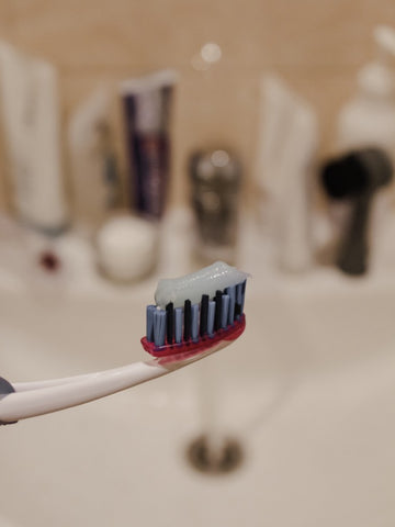 Closeup of toothpaste on traditional toothbrush, for AutoBrush Blog