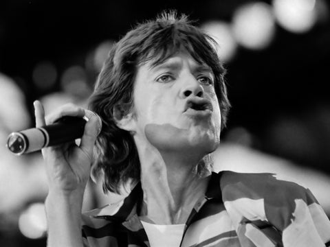 Black and white close-up photo of Mick Jagger on stage, for AutoBrush blog