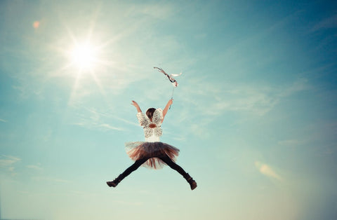 A kid dressed as the tooth fairy