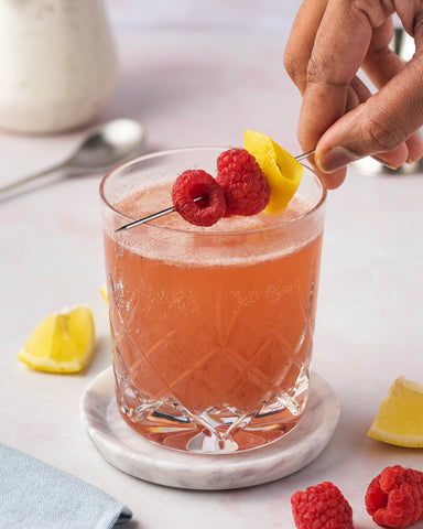 Whiskey sour with raspberry jam