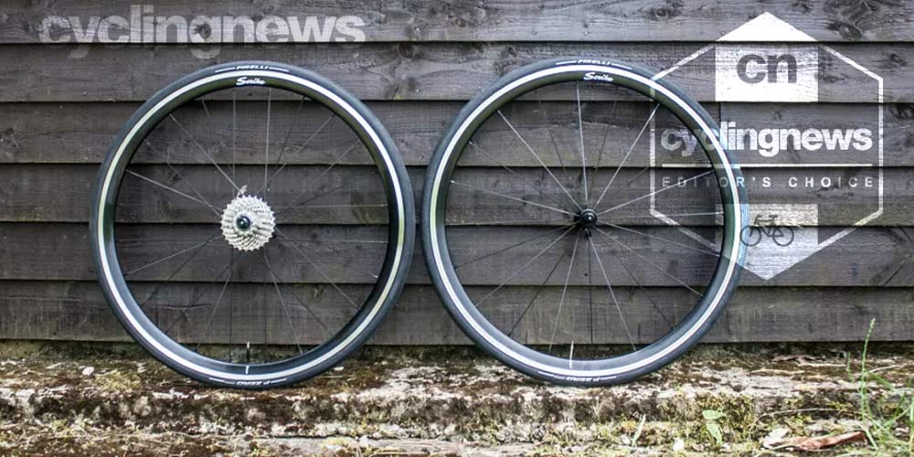 Scribe Pace Rim Brake wheels resting against a wooden backdrop