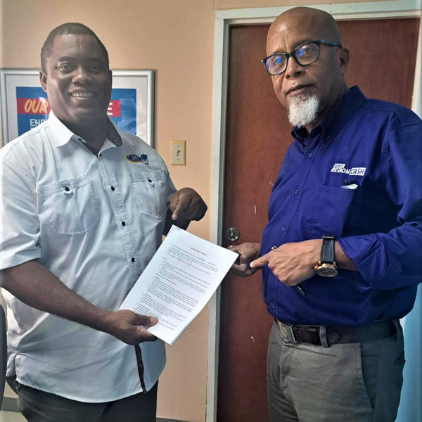 Harris Paints and Courts Ready Financing in Barbados sign the contract to help homeowners afford to paint their homes this holiday season.