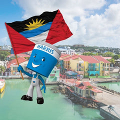 scenic image of Antigua docks with Harris Paints little blue with Antigua flag