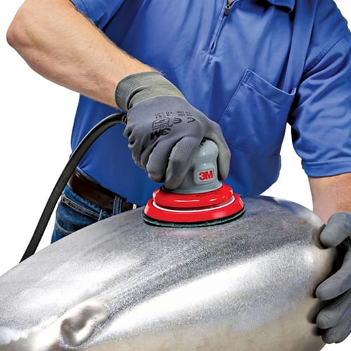 A man using 3M Random Orbital Sander, available at Ricciardi Brothers in NJ, PA & DE.