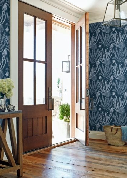 Entrance of a home featuring wallpaper from Wallquest