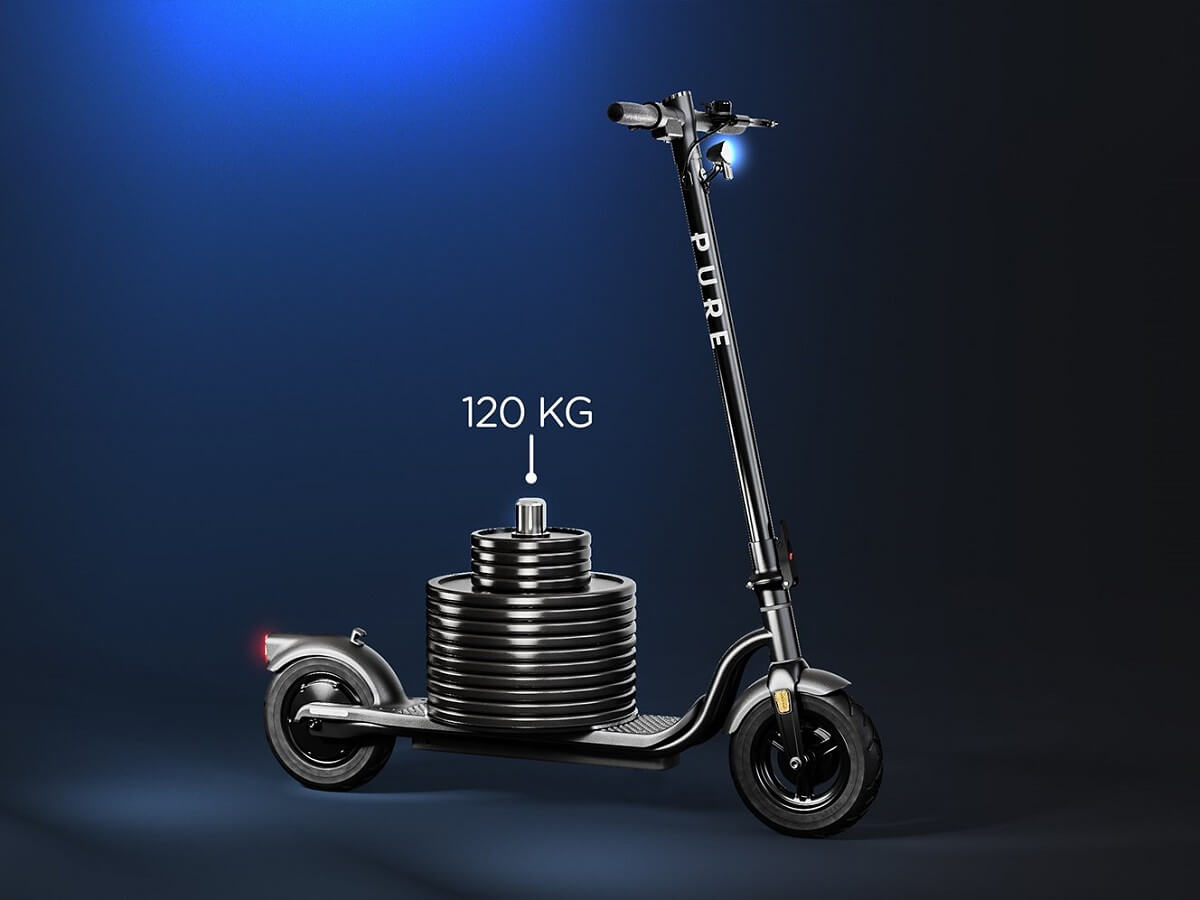 A scooter with a 120kg weight on highlighting maximum load as a consideration when buying an e-scooter