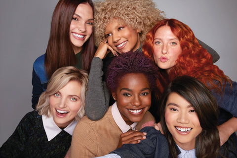 Paul Mitchell The Color Models posing in a group shot laughing and hugging