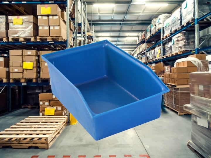 Warehouse packing with a blue Pioneer Plastics storage bin in the foreground