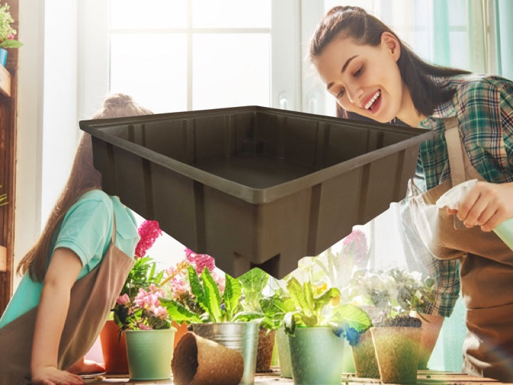 Women and daughter watering the flowers with a brown Pioneer plastics hydroponic tray in the foreground