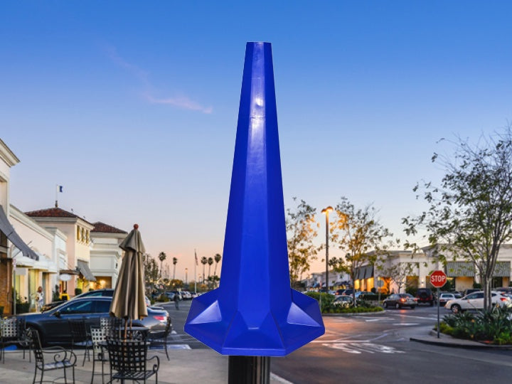 Shopping centre parking lot with a blue Pioneer plastics 1.75cm road cone in the foreground