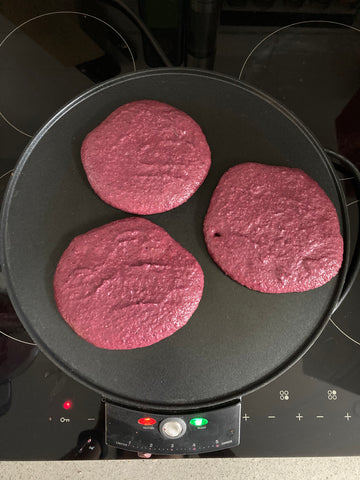 blackcurrant pancakes on a pan