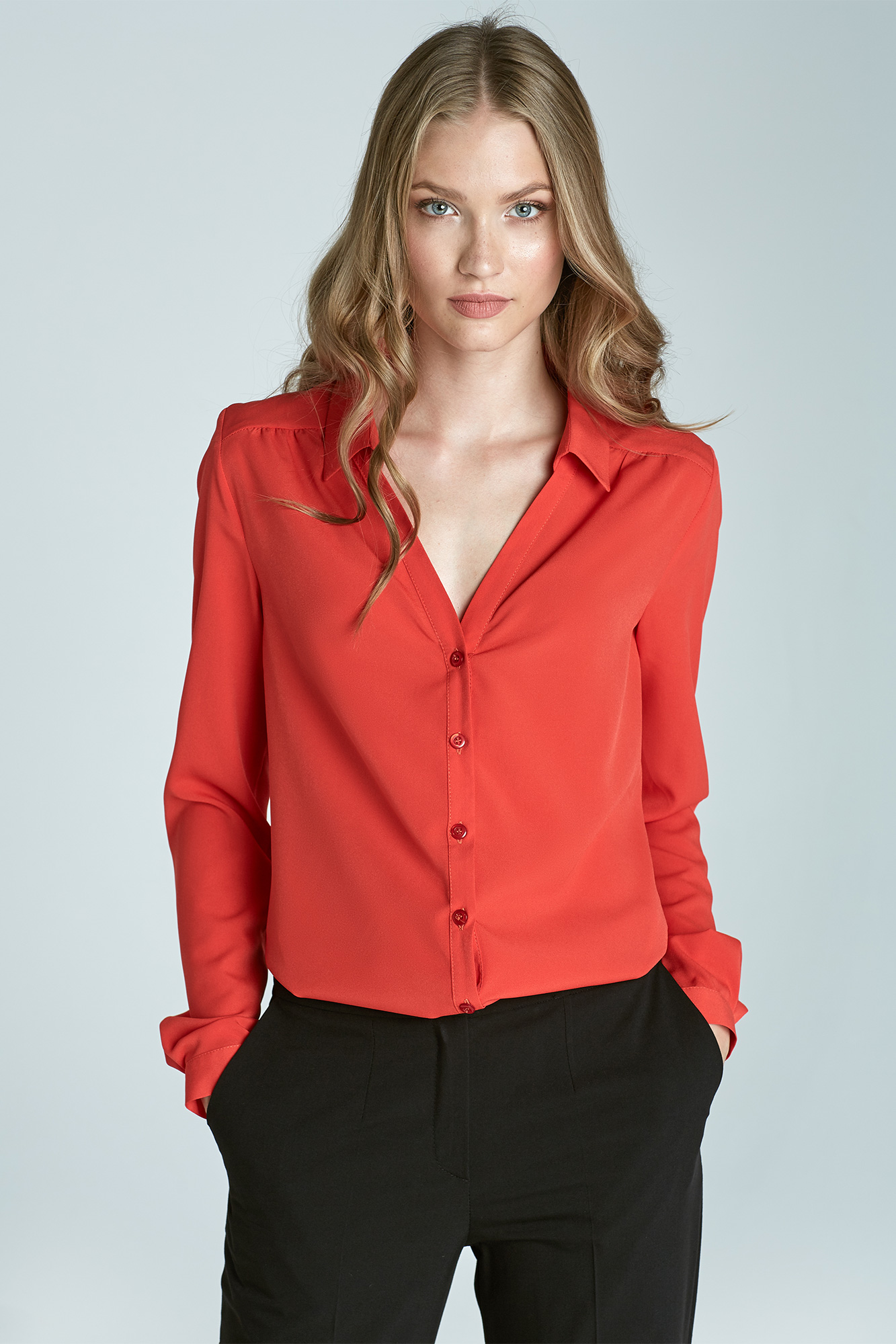 Coral-colored low-cut blouse