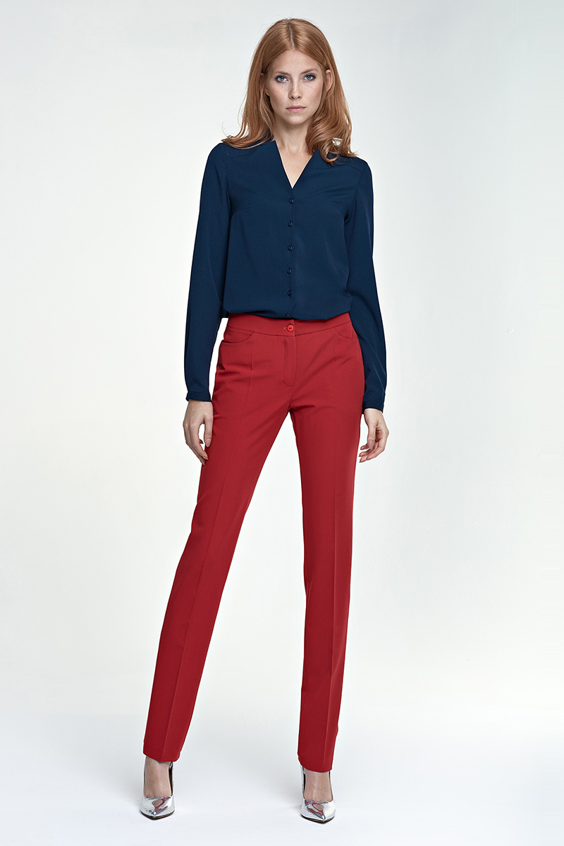 Navy blue low-cut blouse with red tapered pants