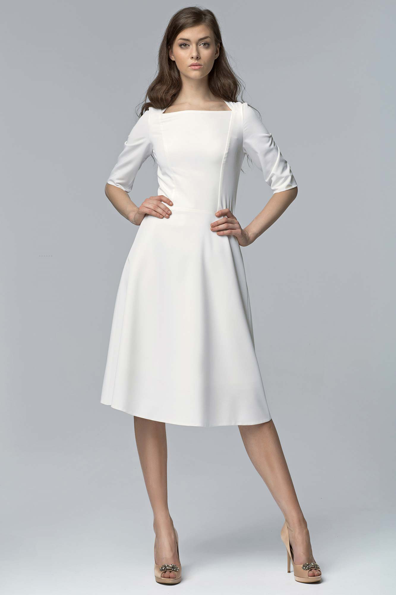 Pretty white dress, short sleeves, knee length.