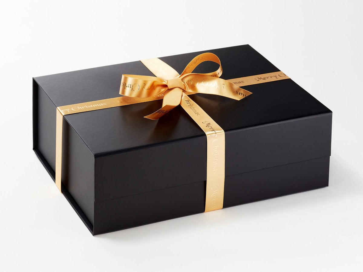 Decorative Black Gift Box With Golden Bow Isolated On White Stock