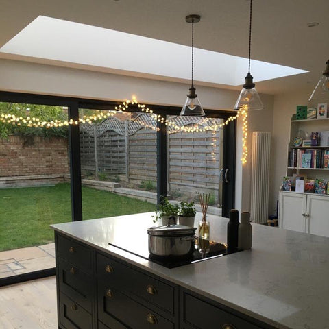 Pom pom string lights along sliding doors