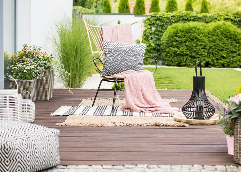 cushions and throws in garden setting