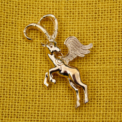 winged ibex brooch