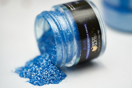 blue drink glitter overspill from a jar