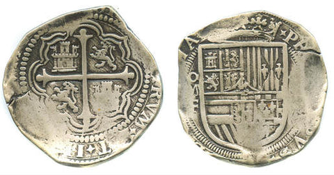 Spanish American Cob Coinage. Obverse features a cross. The Reverse features a shield.
