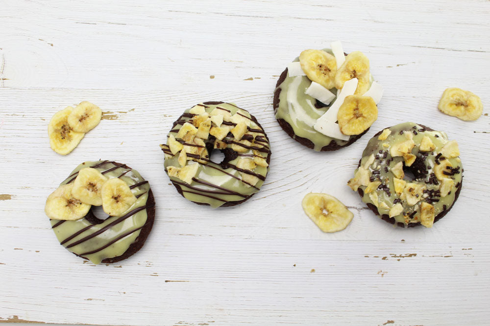 Banana Chocolate Donut with coconut strips, banana chips, and chocolate drizzle.