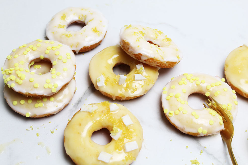 Lemon Donut with coconut strips and yellow confetti sugar decor