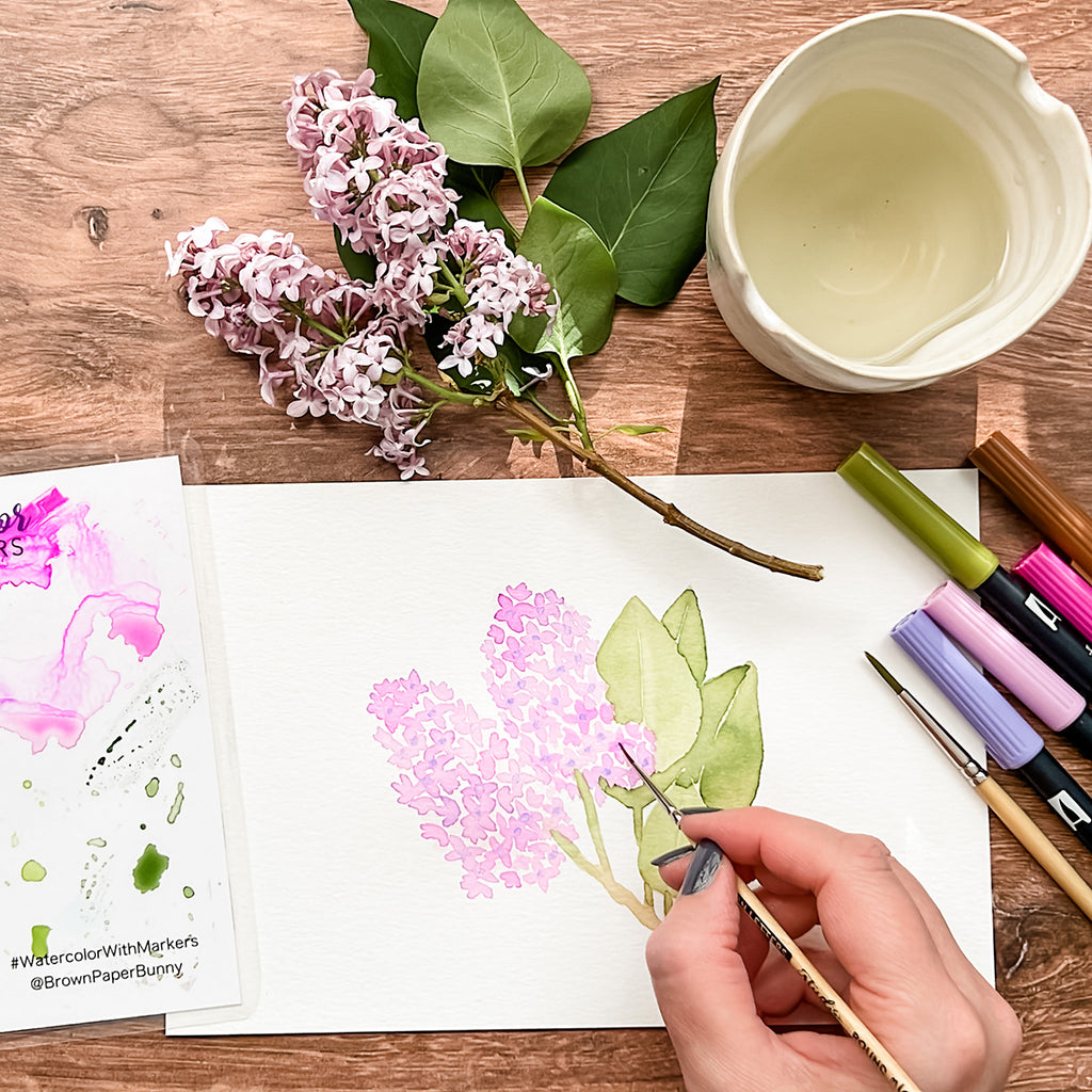 Painting flowers with markers and brushes