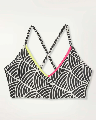 Sport bra from the collaboration between lemlem and Puma incorporating hand-drawn lemlem patterns with fun colors.
