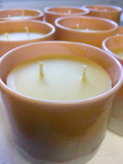 beeswax candles in ceramic cups