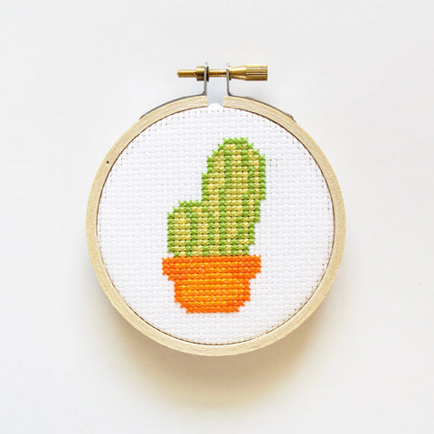 How to frame cross stitch in an embroidery hoop - Peacock & Fig