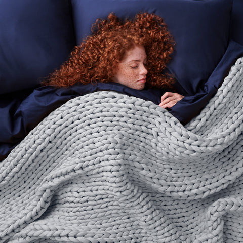 lady sleeping peacefully with weighted blanket