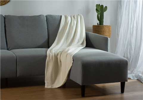 Muslin blanket for adults on couch