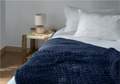 midnight blue muslin blanket on bed