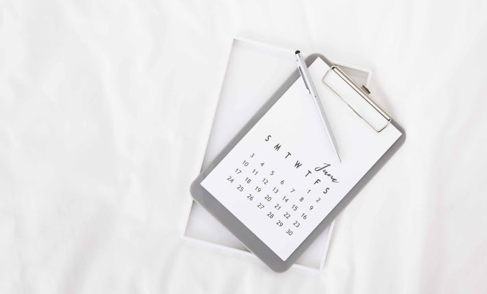 Clipboard holding a small self-made calendar