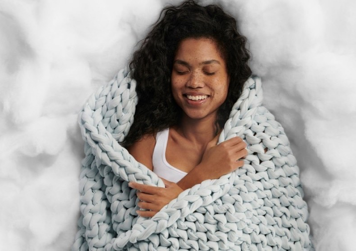 girl in clouds with napper - do weighted blankets help with pain