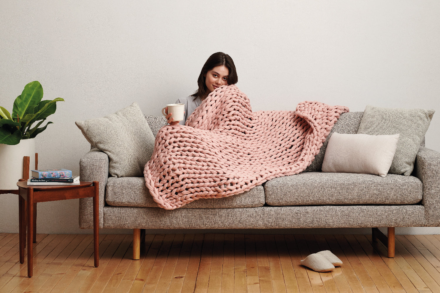 woman figuring out weighted blanket make hot
