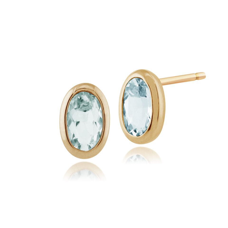 Product photograph of Classic Oval Aquamarine Stud Earrings In 9ct Yellow Gold 6x4mm from Gemondo Jewellery