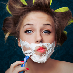 Woman shaving face