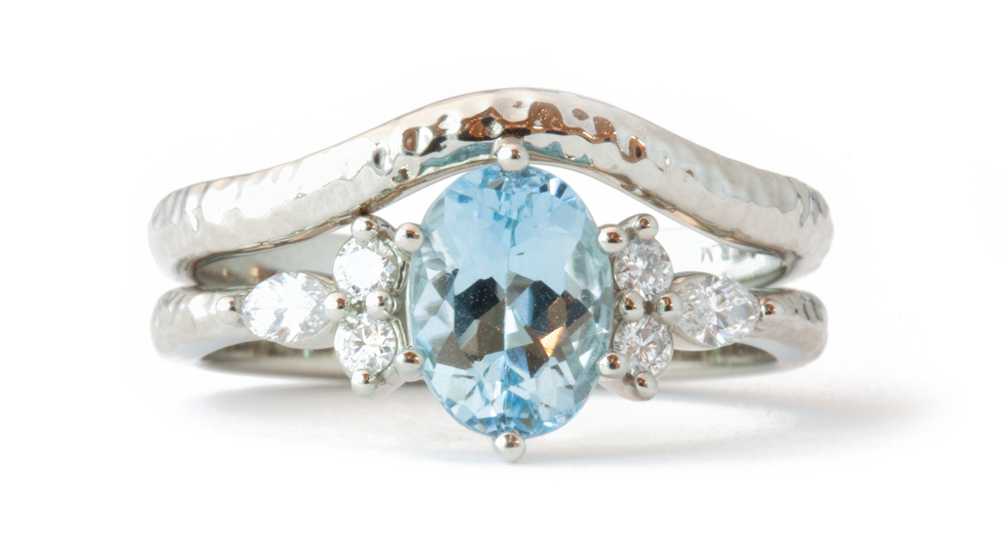 Minimalist Oval ring with aquamarine center stone and diamond accent stones plus hammered contour band