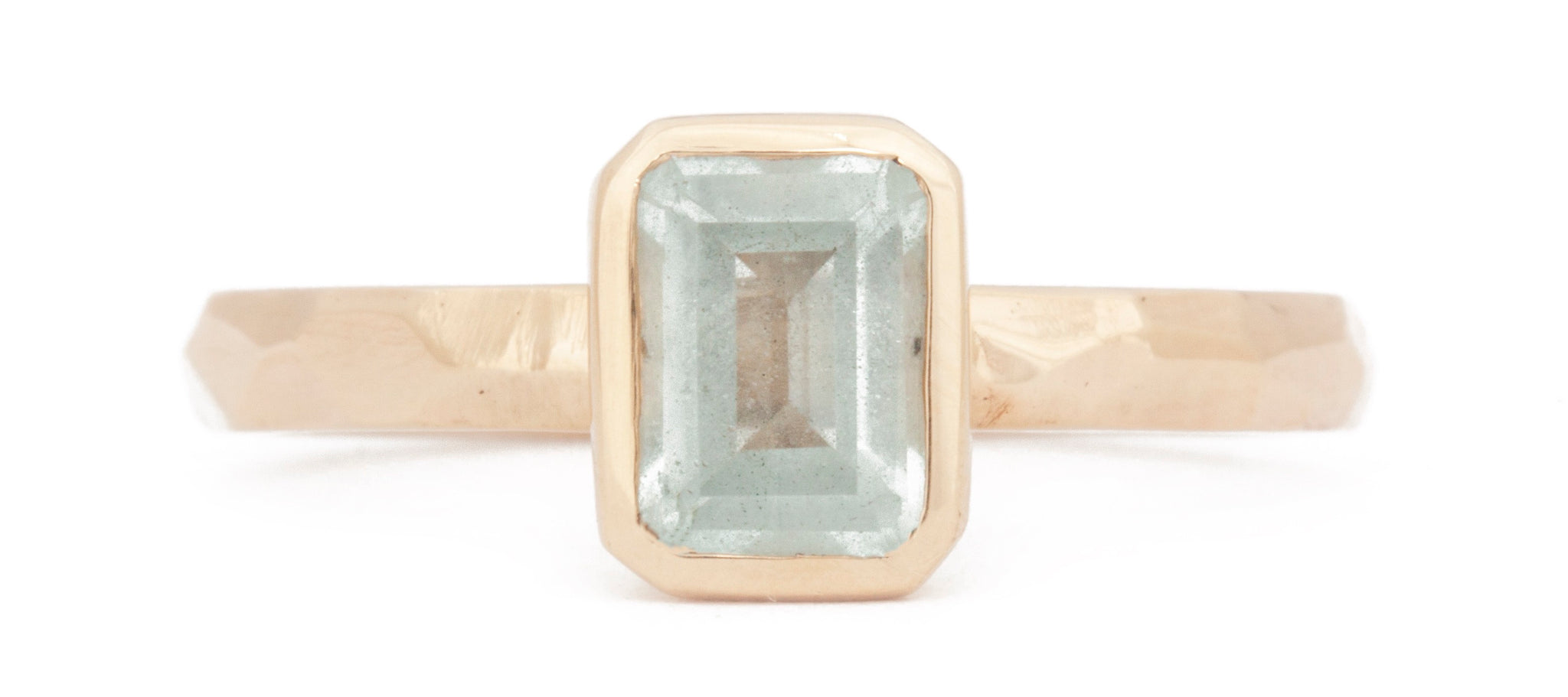 The Fairmined New Hampshire Aquamarine Emerald-Cut Carved Solitaire on white background