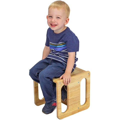 Kid on a Montessori sitting stool