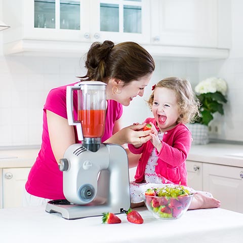 Child making a smoothie