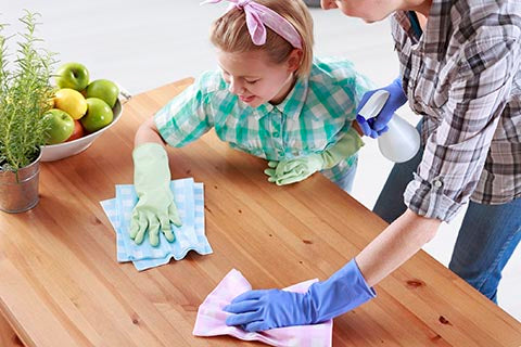 Cleaning kitchen with kid