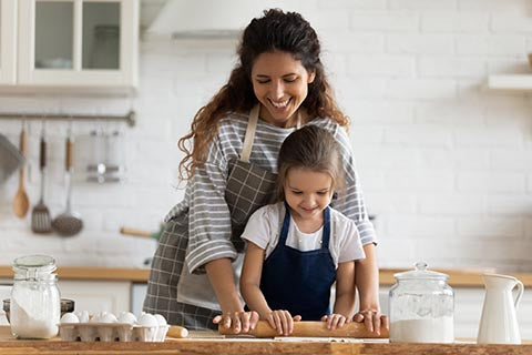 Mom and daughter baking together