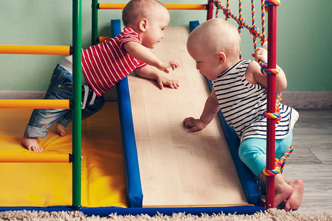 Children climbing on Montessori playroom ladder