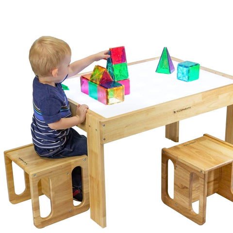 Child playing on a Montessori kids light table