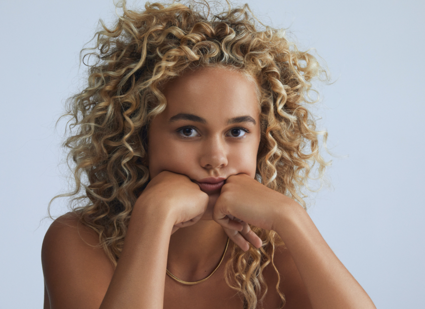 Curly Hair Care - Blonde Girl with Curly Hair