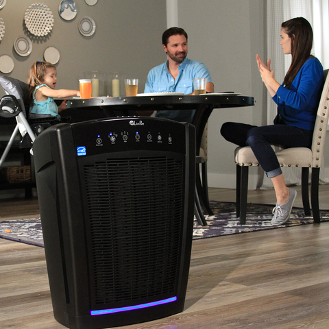 LivePure Bali Air Purifier in dining room with family eating dinner